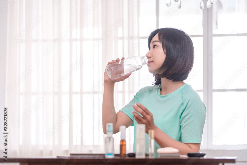 young attractive asian woman who drinks water young attractive asian woman who drinks water