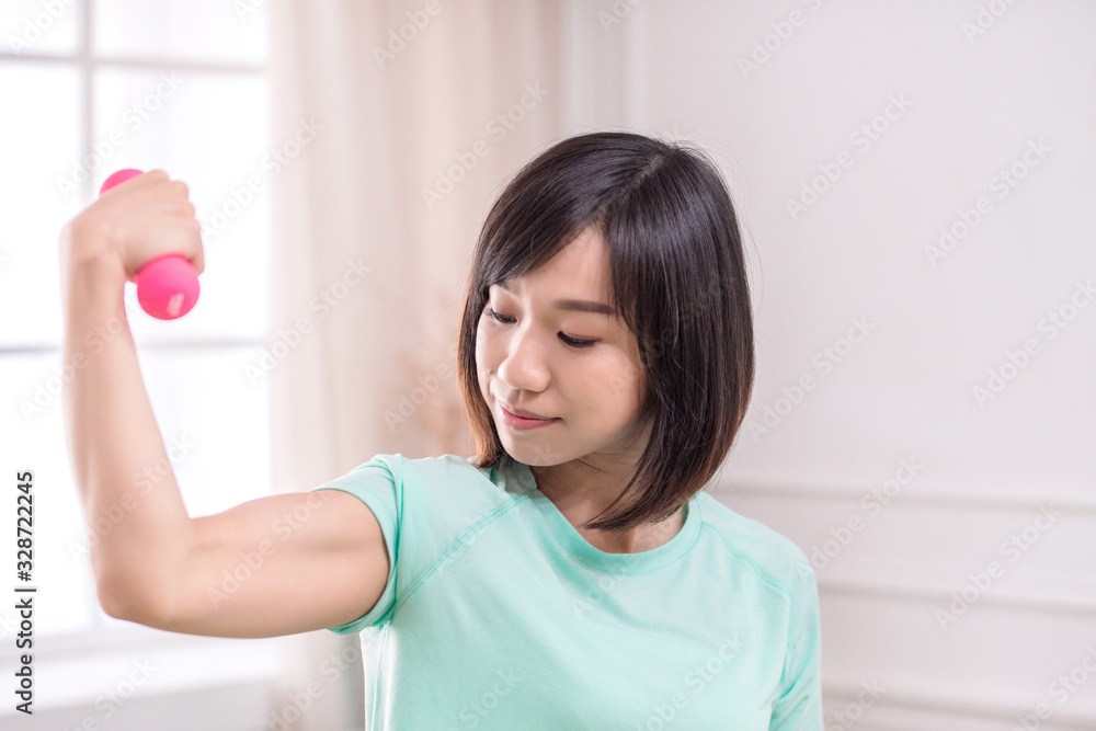 Beautiful Asian girl, Fit sportswoman exercising and training at home Beautiful Asian girl, Fit sportswoman exercising and training at home