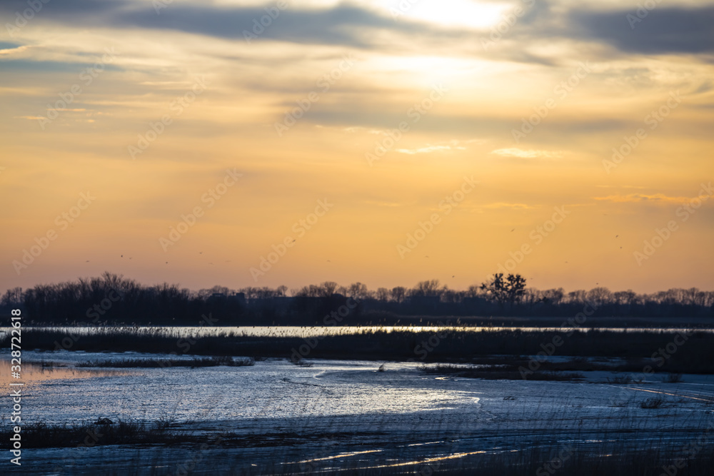 small lake among a prairie at the sunset, evening outdoor background