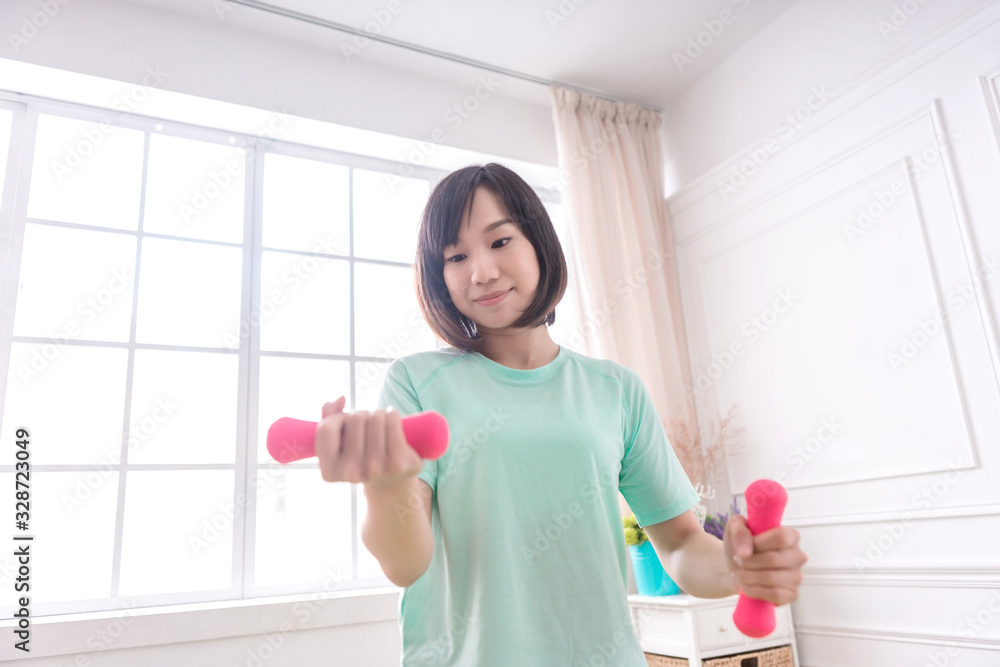 Beautiful Asian girl, Fit sportswoman exercising and training at home Beautiful Asian girl, Fit sportswoman exercising and training at home