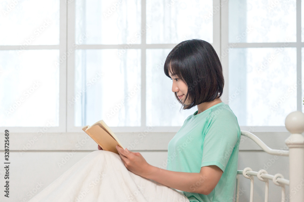 Young girl studying with text book Young girl studying with text book