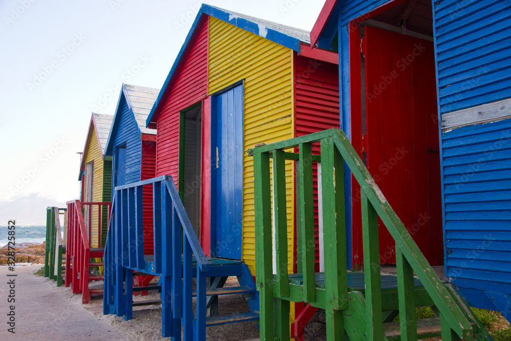 colorful changing huts at st james beach near cape town, south africa