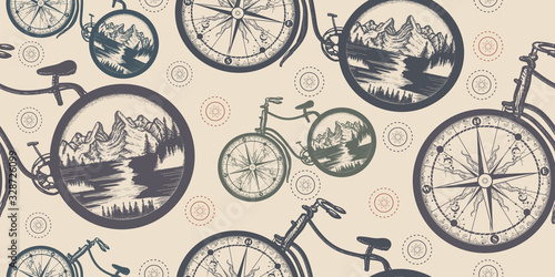 Compass and mountains in bicycle wheels. Seamless pattern. Packing old paper, scrapbooking style. Vintage background. Medieval manuscript, engraving art. Symbol of travel, tourism, adventure