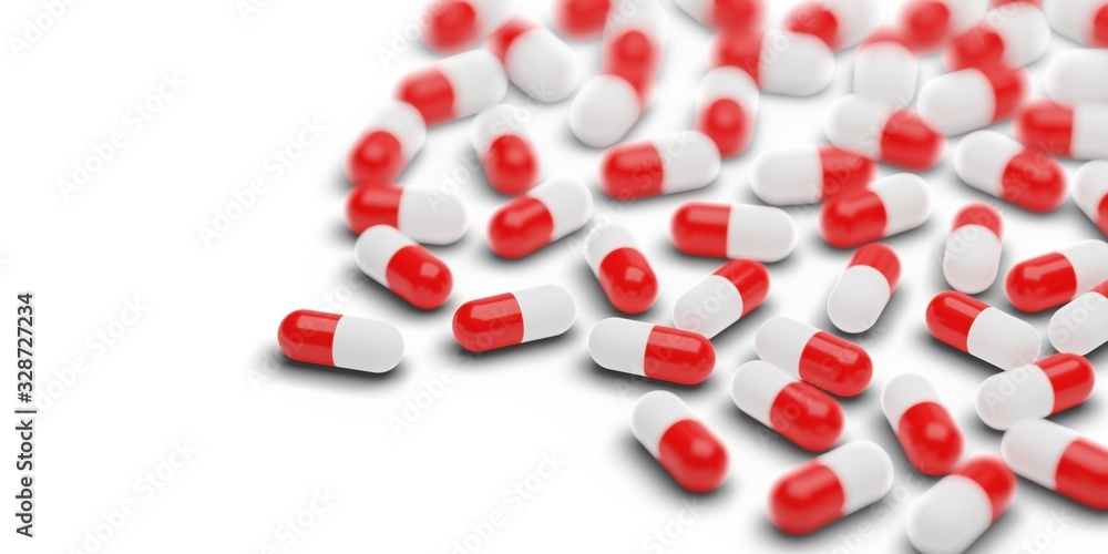 Red pill capsules group over white background - medicine, pharmacy industry or healthcare concept Red pill capsules group over white background - medicine, pharmacy industry or healthcare concept