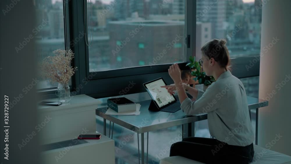 Young female in casual wear using touch pad for network browsing during leisure, Caucasian woman searching media files on website for millennials connected to 4g wireless indoors Young female in casual wear using touch pad for network browsing during leisure, Caucasian woman searching media files on website for millennials connected to 4g wireless indoors