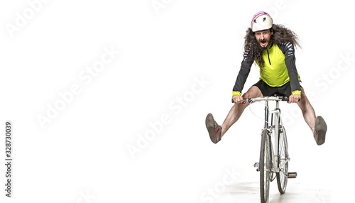 Portrait of a scary cyclist on bike © konradbak