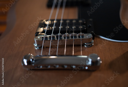 close-up of guitar strings, guitar on black background