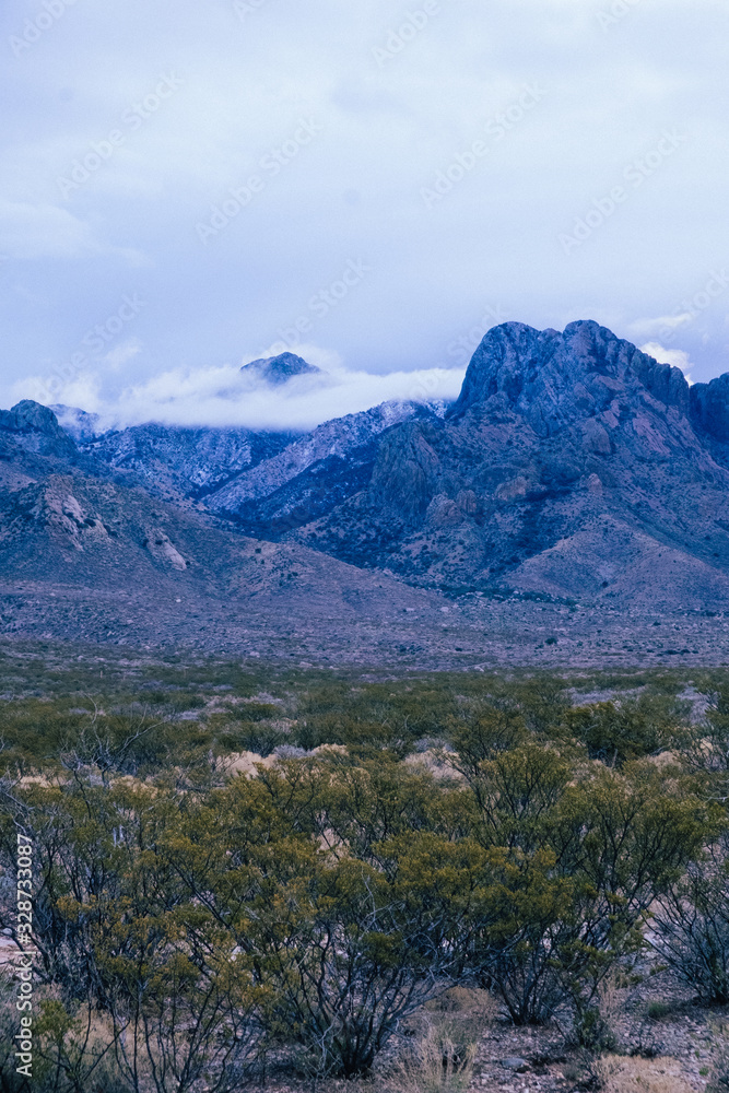 Clouds during blue hour over the Organ Mountain Range in the New Mexico Desert Clouds during blue hour over the Organ Mountain Range in the New Mexico Desert