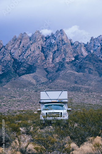 A Truck Camper next to the Organ Mountains of New Mexico during winter on an Overlanding trip