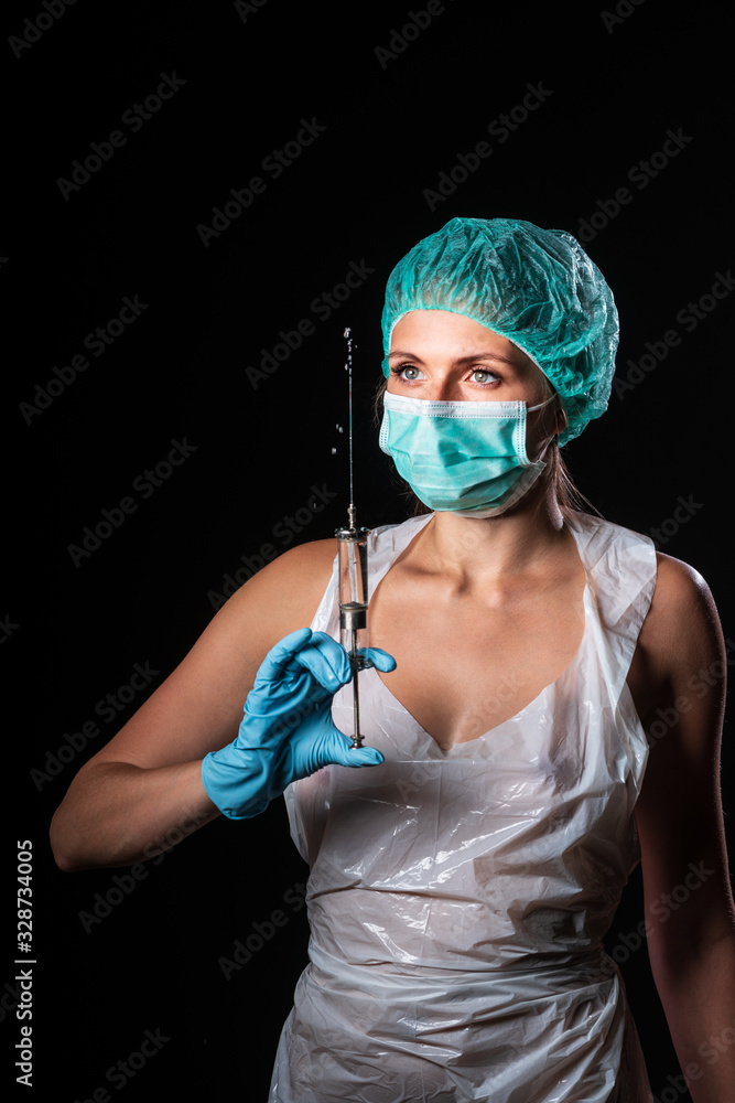 Sexy doctor in medical mask make protective injection. Naked nurse