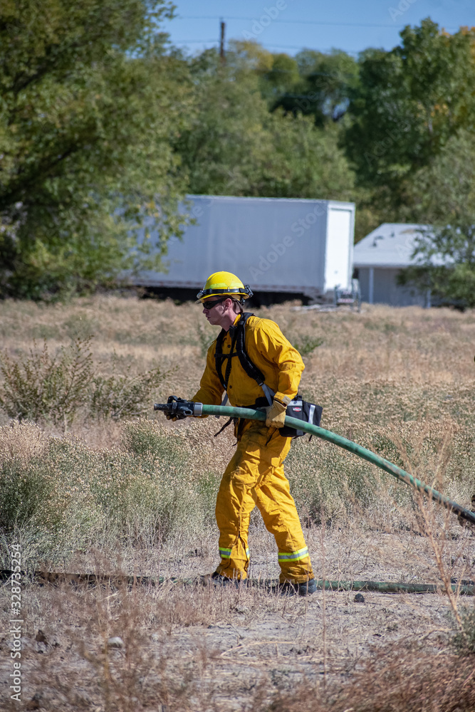 Firefighter Pulling Hose