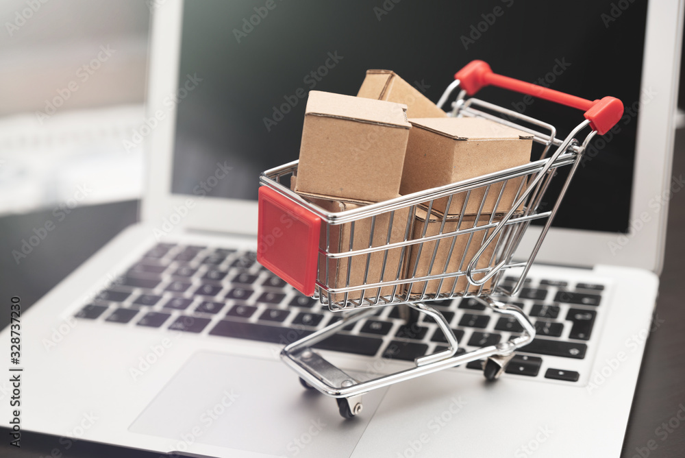 e-commerce, shopping trolley with paper boxes