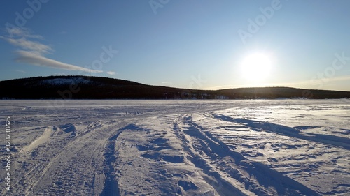 Landscape on the banks of the frozen lake