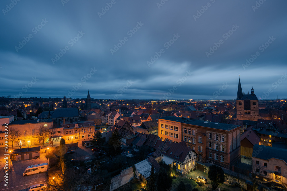 Scenic view over the historic old town of Quedlinburg in Germany in the evening during blue hour