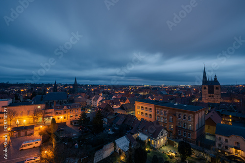 Scenic view over the historic old town of Quedlinburg in Germany in the evening during blue hour © Robert Ruidl
