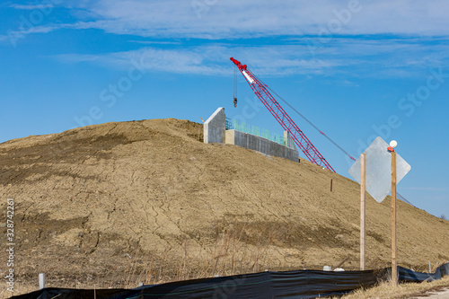 Photography Road construction of highway overpass bridge with concrete abutment