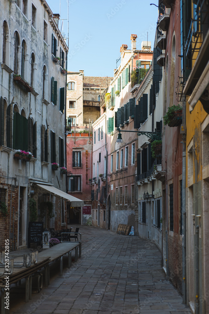Beautiful historic brick buildings on the narrow streets of the ancient city Venice.