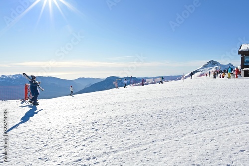  vacationers on a plateau of a ski resort during sunset