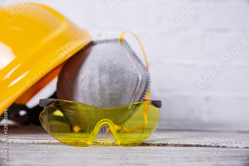 A protective helmet and dust mask is necessary on any construction site. photo