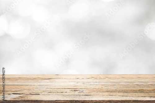 Wood table top on white bokeh abstract background.
