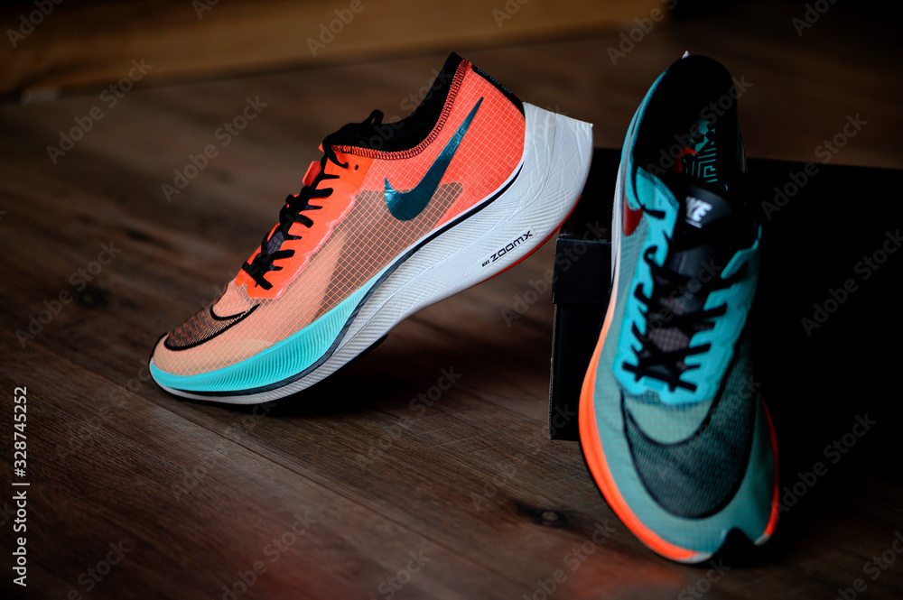 BANGKOK, THAILAND, MARCH 7. 2020: Nike running shoes Vaporfly NEXT%. Controversial Athletics marathon shoe, Ekiden Color version, view on foam and Nike Flyknit uppers, Photo | Adobe Stock