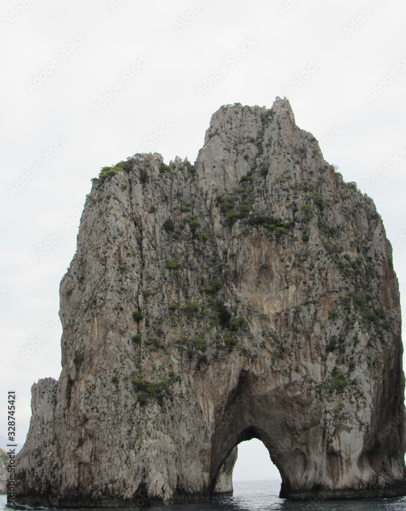 View of the Faraglioni, which are rock formations off the coast of Capri, Italy 