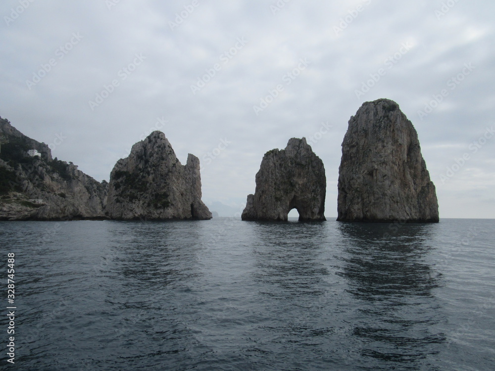 View of the Faraglioni, which are rock formations off the coast of Capri, Italy 