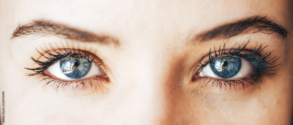 Naklejka premium beautiful blue eyes with long eyelashes lenses vision