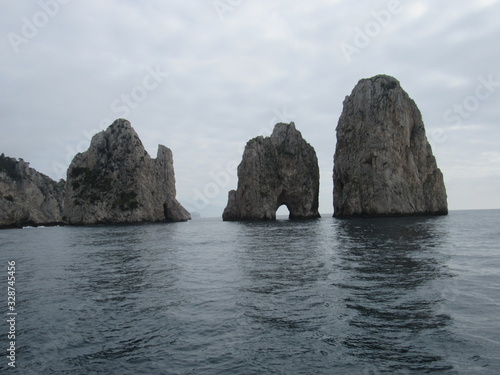 View of the Faraglioni, which are rock formations off the coast of Capri, Italy 