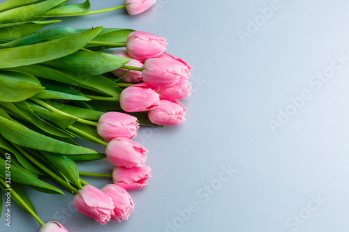Fototapeta Naklejka Na Ścianę i Meble -  A bouquet of pink tulips on the table for International Women's Day