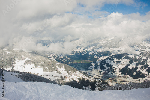 Ski slope, resort and outdoor activities in the winter in the Alps. © Evgenii Starkov