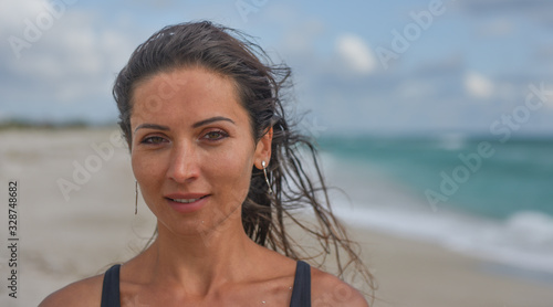 dark-haired girl on the beach portrait