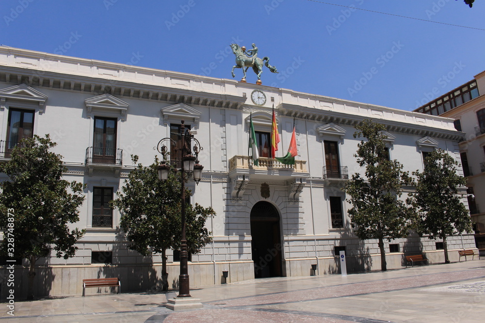 Fototapeta premium Granada city hall building with a horse statue on top in Andalusia, Southern Spain.