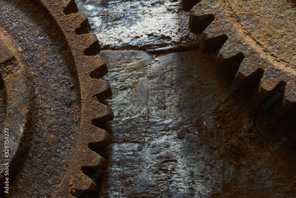 Rusty gears from old mechanism photographed at close range. Rusty gears from old mechanism photographed at close range.