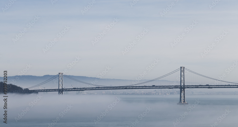 Obraz premium San Francisco Oakland Bay Bridge in Fog Panoramic