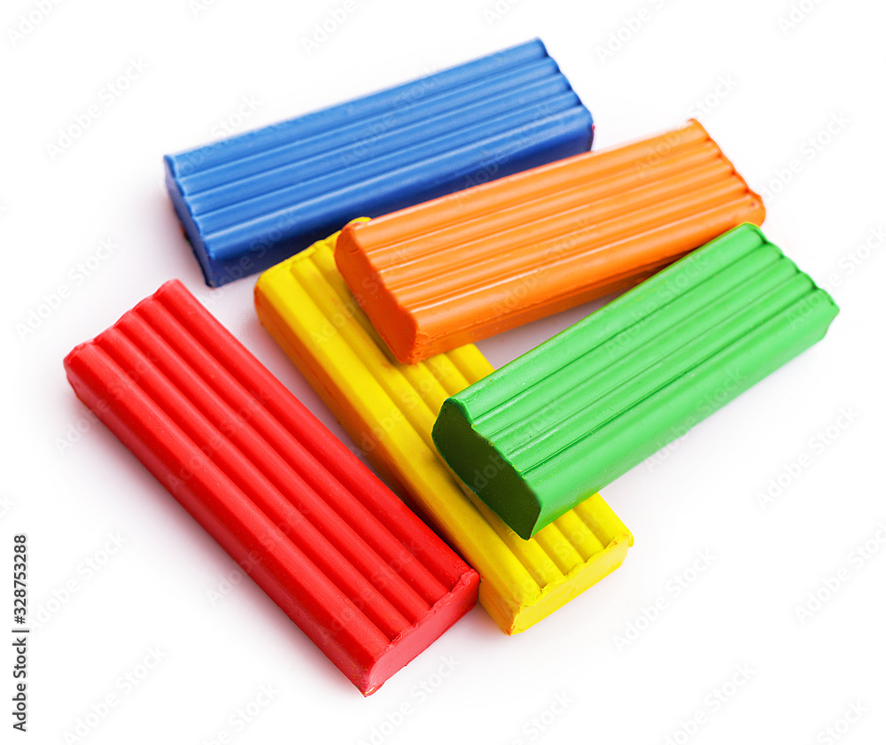 Multi-colored plasticine on a white background Multi-colored plasticine on a white background