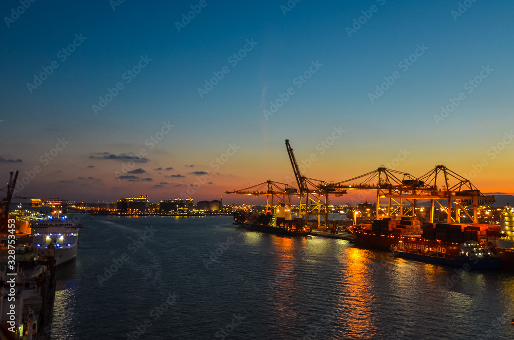 Elevated view onto the Port of Hamburg (Hamburg Hafen), Germany at sunset. The Port of Hamburg is Germanys biggest port, located at the Elbe river. Elevated view onto the Port of Hamburg (Hamburg Hafen), Germany at sunset. The Port of Hamburg is Germanys biggest port, located at the Elbe river.