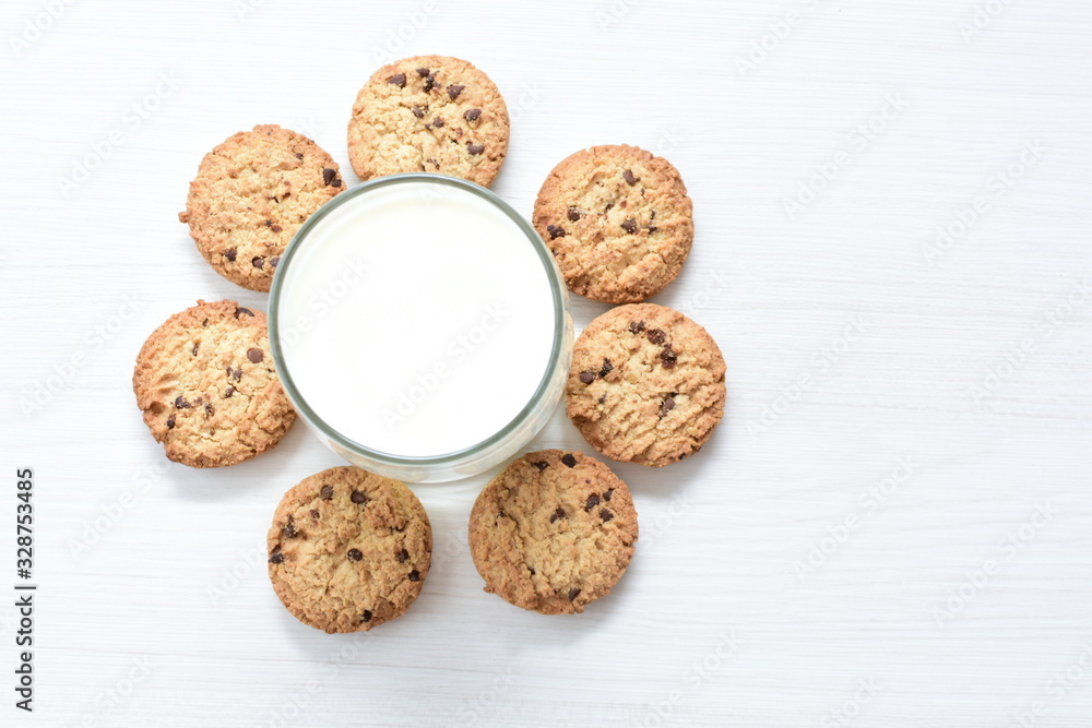Oatmeal cookies and chocolate chips on light background Oatmeal cookies and chocolate chips on light background