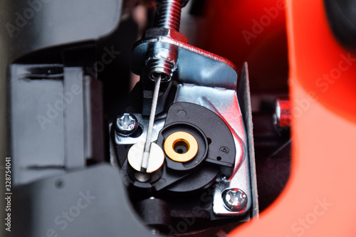 Elements of the fuel system of a gasoline trimmer. Fuel tank and carburetor trimmer engine. Fuel system of a carburetor two-stroke engine. photo