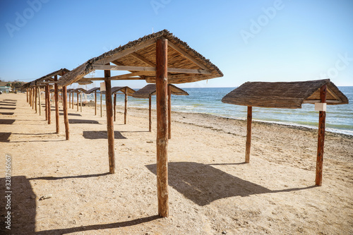 Straw canopies on the sea shore