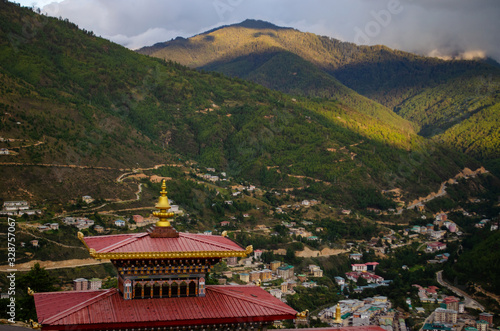 Sunlit mountains and shadowy valleys covering the Thimphu city located at the valley of Bhutan