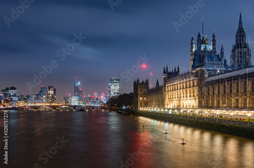 London in the night, Houses of Parliament (Palace of Westminster) and modern Vauxhall district over river Thames