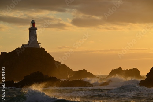 Corbiere lighthouse, Jersey, U.K. Beacon at sunset in Spring.