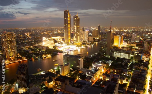 Bangkok skyline night city with river in Thailand