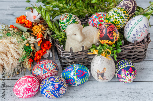 Easter. Colorful Easter eggs in basket and Easter palm