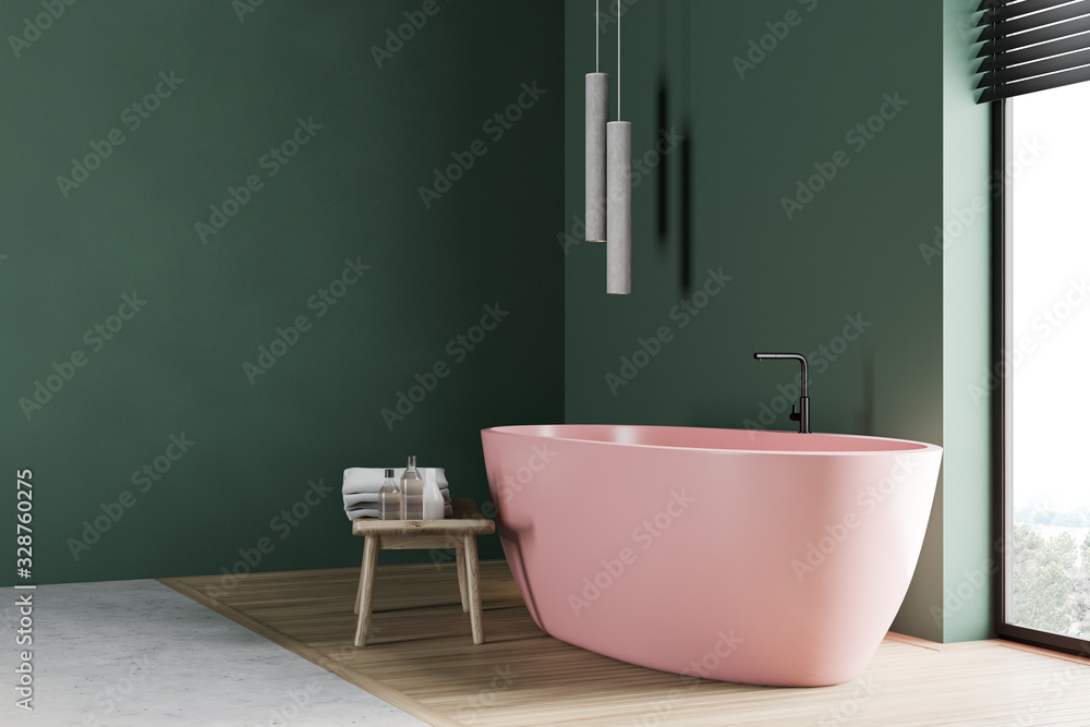 Green bathroom corner with pink tub Stock Photo | Adobe Stock