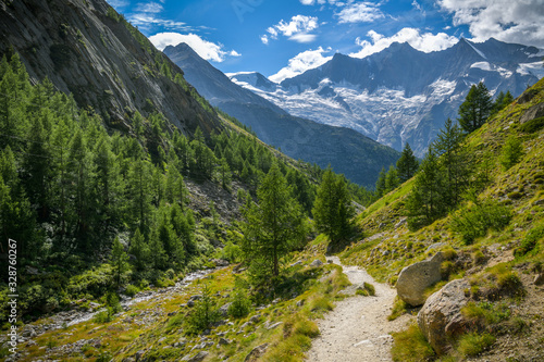 Hiking trail to Saas-Almagell village in Swiss Alps with incredible views on majestic peaks