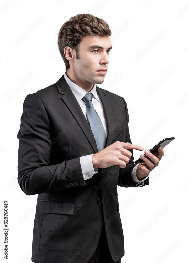 Serious businessman using smartphone, isolated Serious businessman using smartphone, isolated