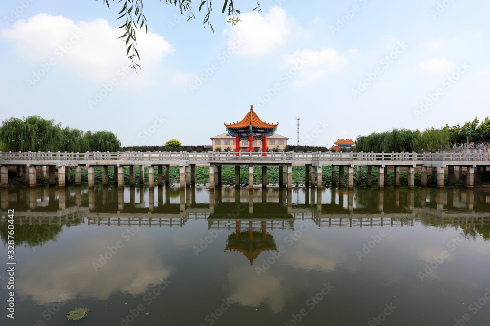 Naklejka premium Chinese Classical Traditional Architecture in Artificial Lake