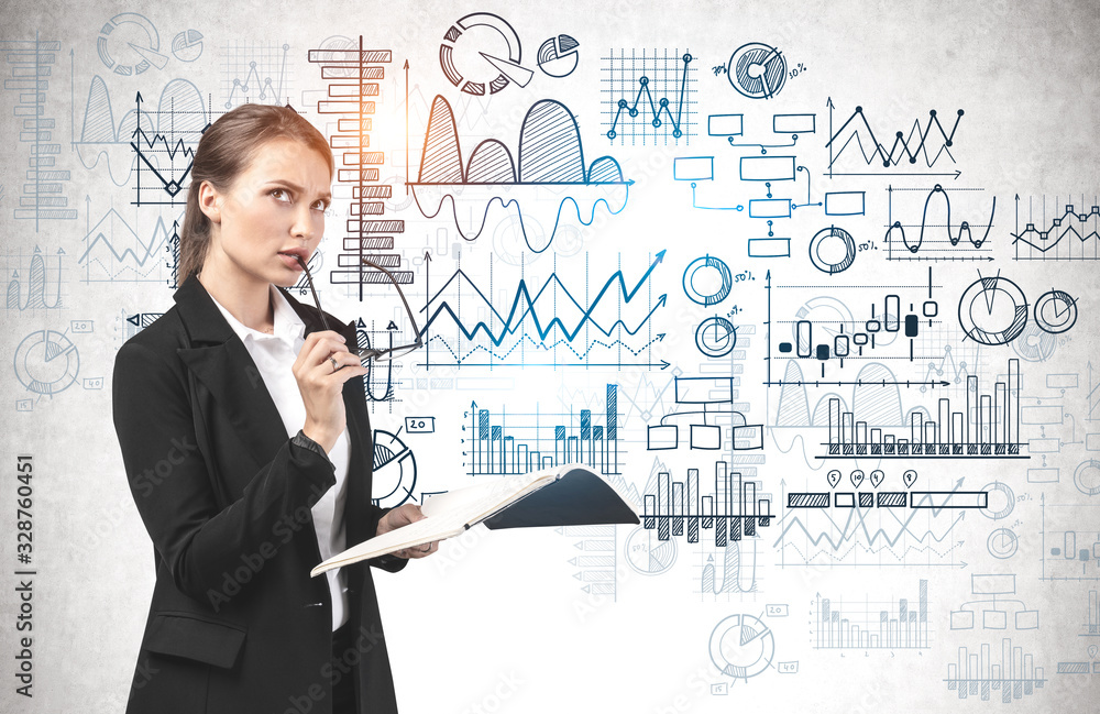 Woman with glasses and notebook, graphs on wall Woman with glasses and notebook, graphs on wall